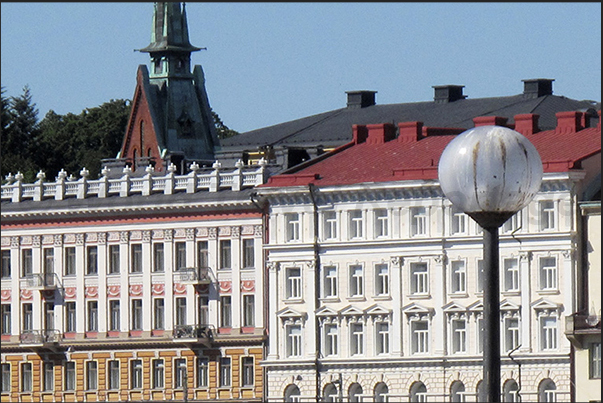 Covered market square (Avenue Etelaranta) and behind the bell tower of the German Church of Helsinky Covered market square (Avenue Etelaranta) and behind the bell tower of the German Church of Helsinky