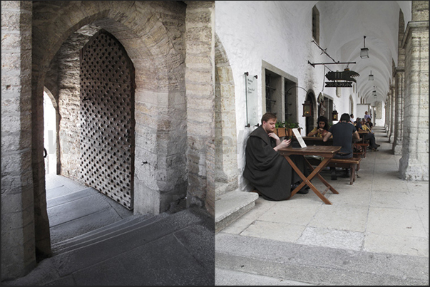 Entrance door to the medieval quarter and a medieval style restaurant