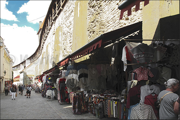 The street of the stalls under the medieval walls The street of the stalls under the medieval walls