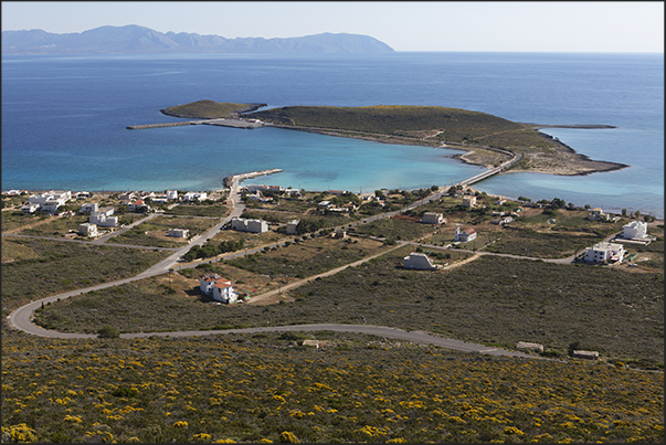 South east coast. Dhiakofti harbor and the island of Makrykythira. On the horizon, the coast of Peloponnese South east coast. Dhiakofti harbor and the island of Makrykythira. On the horizon, the coast of Peloponnese
