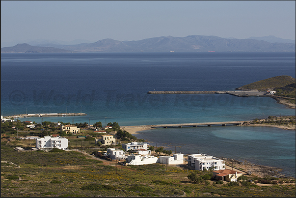 South east coast. Dhiakofti harbor and the island of Makrykythira. On the horizon, the coast of Peloponnese South east coast. Dhiakofti harbor and the island of Makrykythira. On the horizon, the coast of Peloponnese