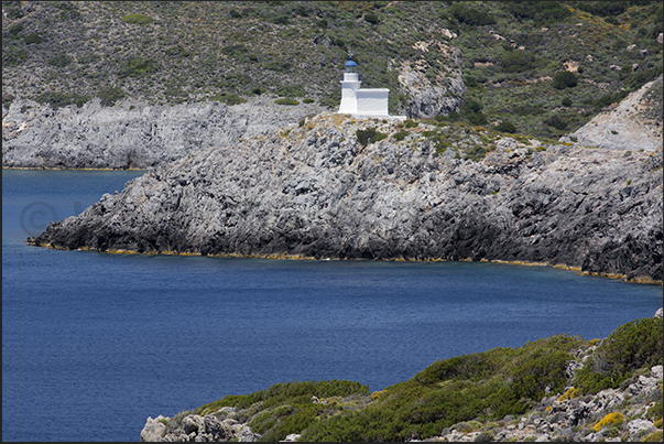 The lighthouse under the cliffs of Hora, the capital of island