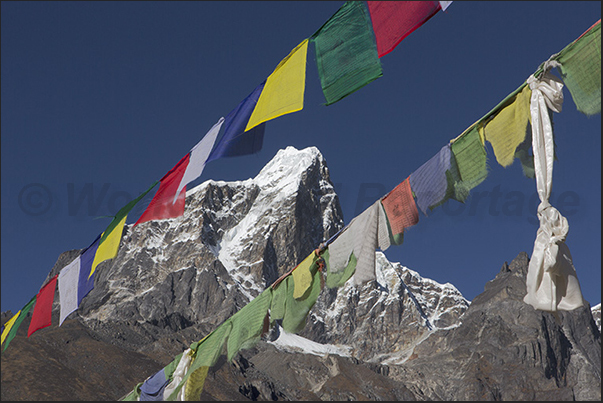 Acclimatization. Climb to Mount Nangkar Tshang (5083 m). Mount Tabuche and prayers in the wind Acclimatization. Climb to Mount Nangkar Tshang (5083 m). Mount Tabuche and prayers in the wind