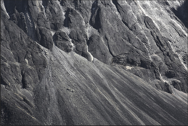 A dusting of snow on the dark rocks on the base of Mount Ama Dablam (6814 m) A dusting of snow on the dark rocks on the base of Mount Ama Dablam (6814 m)