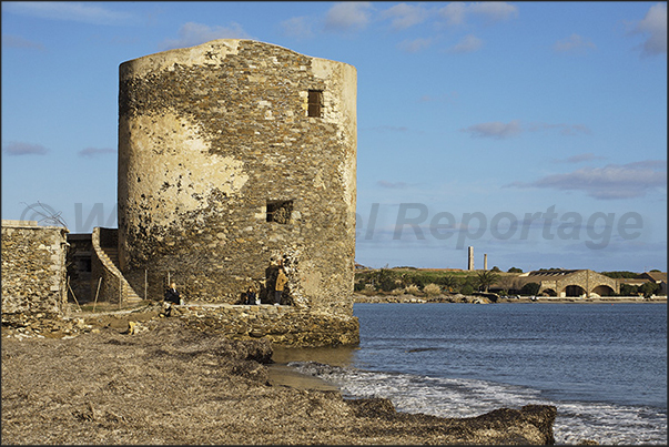 Tower of the salterns near the old tunny fishing nets of Stintino and near the ponds where the pink flamingos gather Tower of the salterns near the old tunny fishing nets of Stintino and near the ponds where the pink flamingos gather
