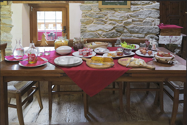 Breakfast with typical products such as cheeses, salami, honey and jams