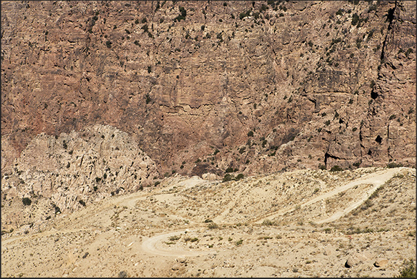 The trail from Dana village to Feynan crosses the reserve between high rock walls The trail from Dana village to Feynan crosses the reserve between high rock walls