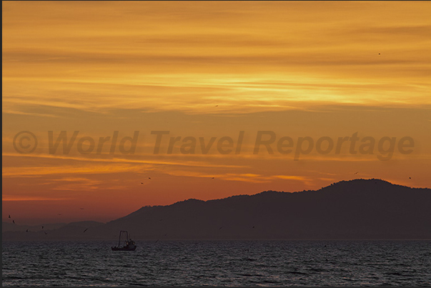 The hills of Hyeres seen from the beach of Brégançon Bay