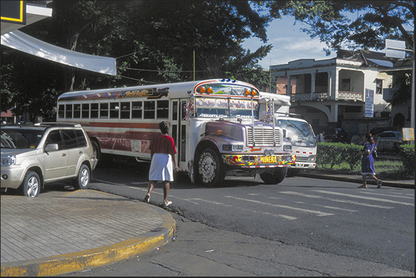 Colon Town on the Caribbean side. Typical colored buses Colon Town on the Caribbean side. Typical colored buses
