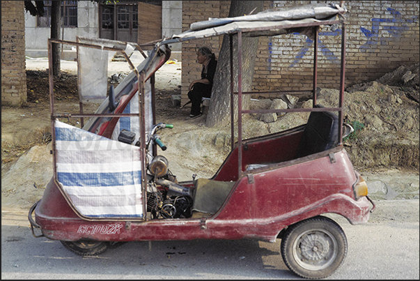 Mongin Village. The scooter is the most used motor vehicle used by peasants