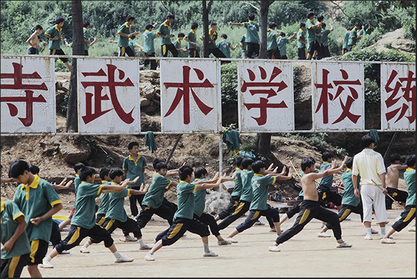 Shaoling. Martial Arts Schools. The kids learn kung fu in the school squares Shaoling. Martial Arts Schools. The kids learn kung fu in the school squares