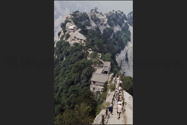 Huashan Mountains (near Xian). The long and steep stairways that leading on the top of the five peaks of Mount Hua Huashan Mountains (near Xian). The long and steep stairways that leading on the top of the five peaks of Mount Hua