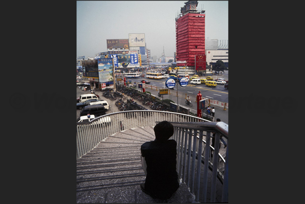 The fields disappear as the future and modernity grow to the eye of the young Chinese