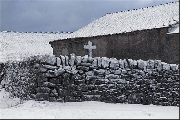 Village of Sainte Lucie, headquarters of Gevaudan wolf park. The small cemetery Village of Sainte Lucie, headquarters of Gevaudan wolf park. The small cemetery