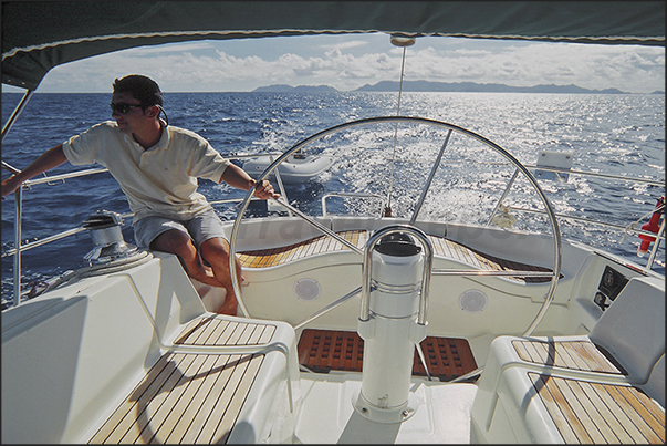 Sailing to Anguilla Island. On the horizon the island of Saint Martin