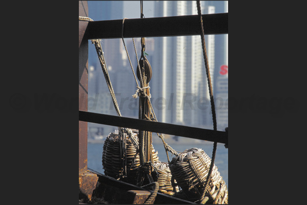 Junks, ferries and ships cross Victoria Harbor during day and night