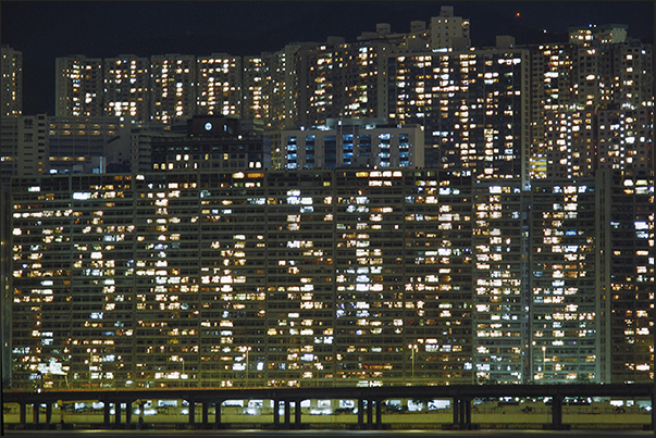 A wall of lights overlooks Victoria Harbor