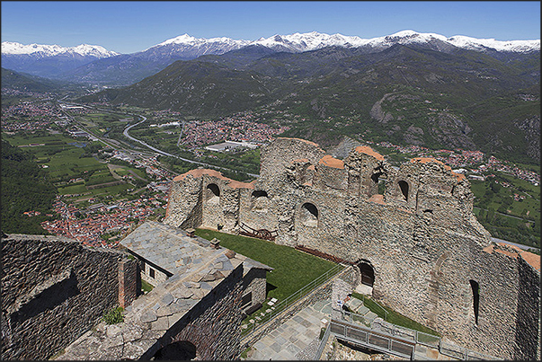 The ruins of the castle to protect the abbey dominate Susa Valley