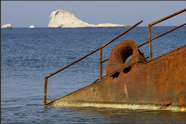 Rocky beaches of Sarakinikos. Wreck of a small merchant