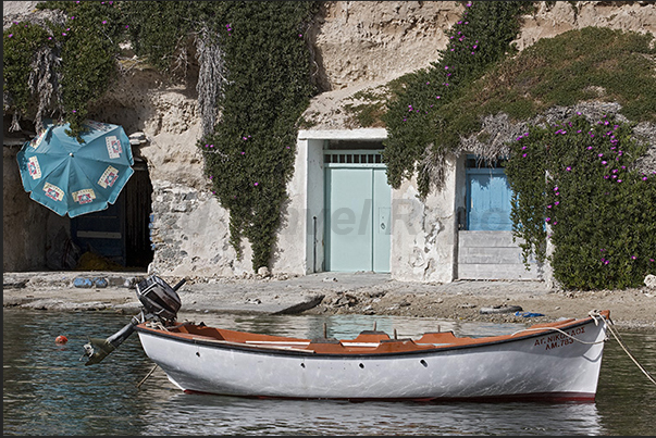 Mandrakia. The storage rooms for fishing equipment carved into the rock of the cliff