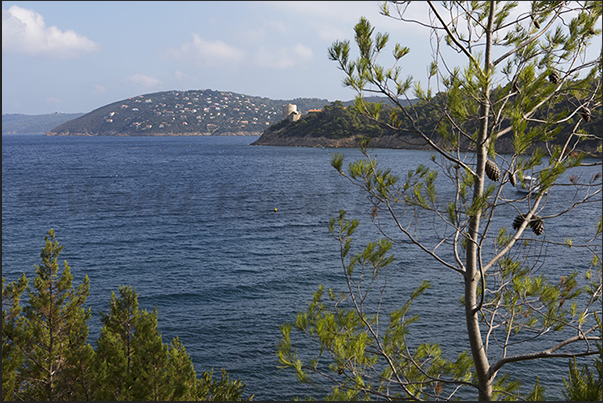 Port Man Bay and, on the horizon, the island of Levant Port Man Bay and, on the horizon, the island of Levant