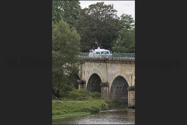 Passage on the fluvial bridge of Digoin a navigable bridge that crosses the river Loire