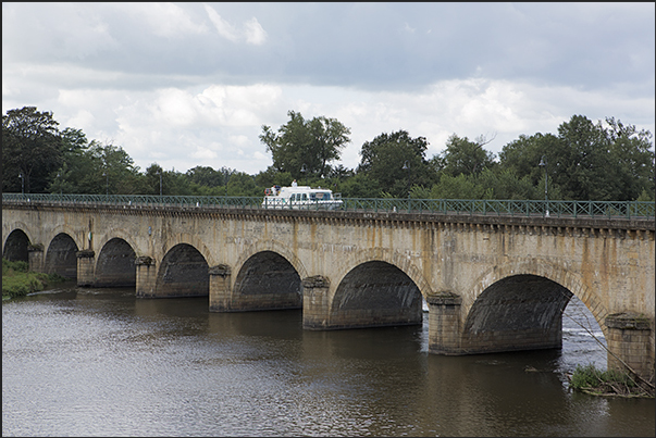 Passage on the fluvial bridge of Digoin a navigable bridge that crosses the river Loire Passage on the fluvial bridge of Digoin a navigable bridge that crosses the river Loire