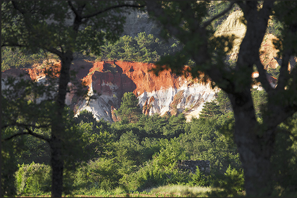 The valley of ocher and red earth called Provencal Canyon on the road from Rustrel to the village of Apt