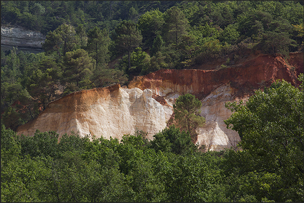 The valley of ocher and red earth called Provencal Canyon on the road from Rustrel to the village of Apt The valley of ocher and red earth called Provencal Canyon on the road from Rustrel to the village of Apt