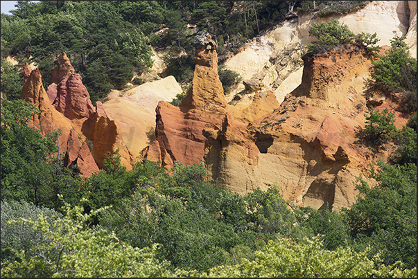 Walking you encounter particular rocky shapes created by rain and wind