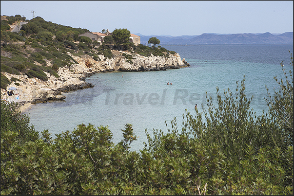 The east coast of Saint Antioco Island near the village of Portixeddu. On the horizon the eastern coasts of Sardinia The east coast of Saint Antioco Island near the village of Portixeddu. On the horizon the eastern coasts of Sardinia