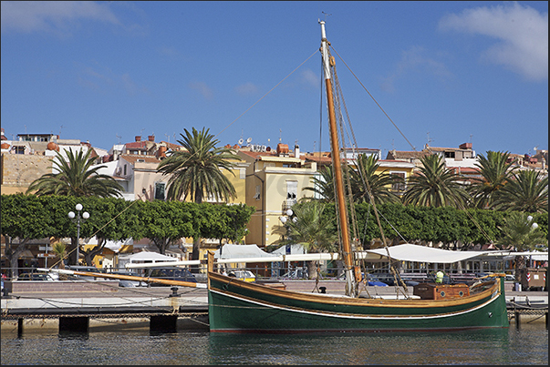 Saint Pietro Island, Carloforte harbor. The boat that once transported minerals from the coasts to merchant ships Saint Pietro Island, Carloforte harbor. The boat that once transported minerals from the coasts to merchant ships