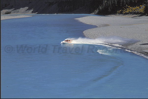 Jet Boat in the gorge on the blue waters of Rakaia River Jet Boat in the gorge on the blue waters of Rakaia River