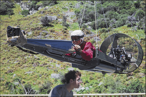 The Zorb, the transparent sphere, descends quickly to the shores of Rotorua Lake