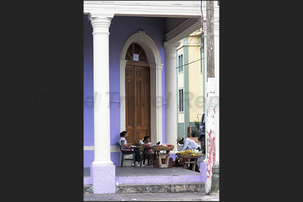 Granada. Colonial architecture in the main square of the town. A little shop of fruit and vegetables