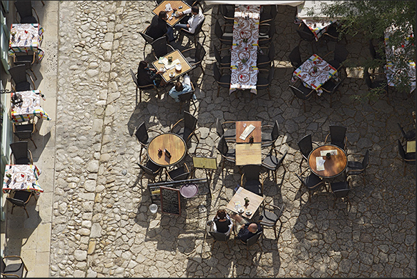 Medieval village of Saint Emilion. Restaurants in the village square Medieval village of Saint Emilion. Restaurants in the village square