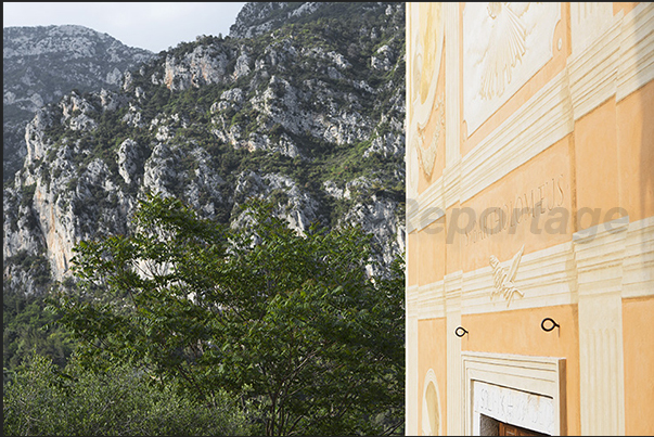 Gorbio. Facade of Saint Barthelemy church (XVII century) and behind the climbing walls Gorbio. Facade of Saint Barthelemy church (XVII century) and behind the climbing walls