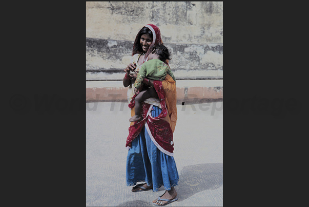 Agra. People ask for alms, outside the walls of the ancient town