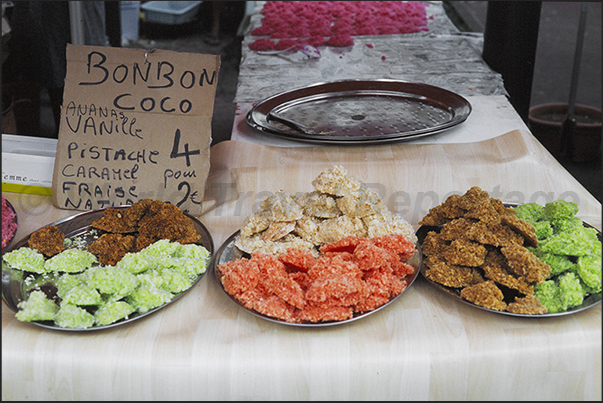 Saint Paul market, north-western coast. Stall of coconut sweets Saint Paul market, north-western coast. Stall of coconut sweets