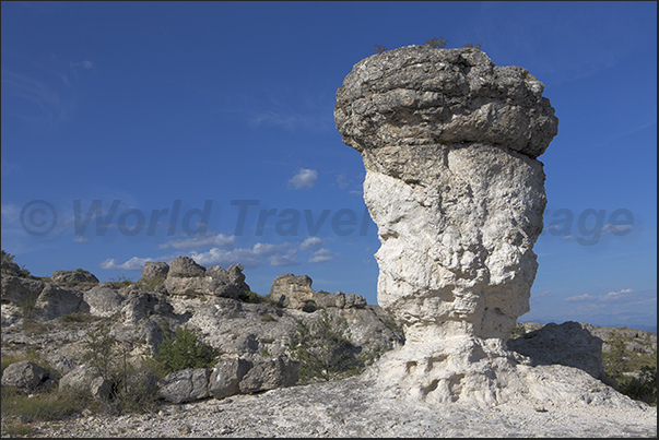 Les Mourres. A path runs through the valleys to discover columns and rocks with particular shapes eroded by water and wind Les Mourres. A path runs through the valleys to discover columns and rocks with particular shapes eroded by water and wind