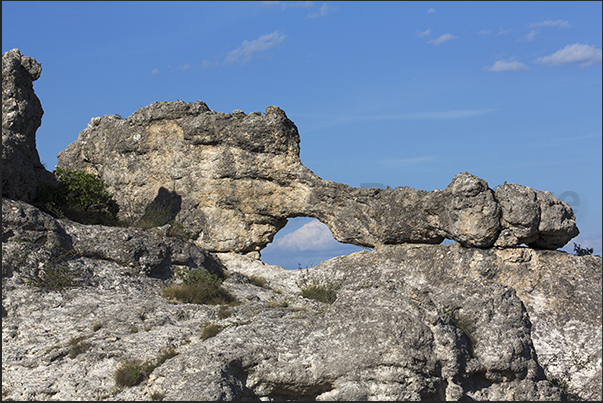 Les Mourres. Along the path you can see several rock masses with large windows that open onto Durance river valley Les Mourres. Along the path you can see several rock masses with large windows that open onto Durance river valley