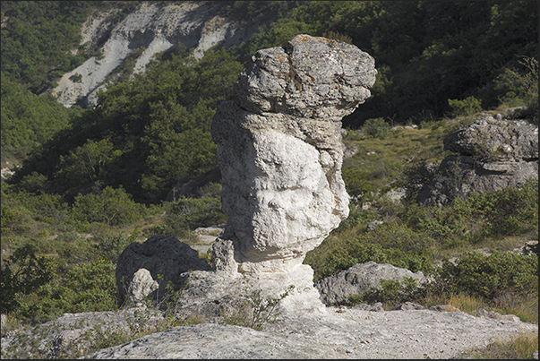 Les Mourres. A path runs through the valleys to discover columns and rocks with particular shapes eroded by water and wind Les Mourres. A path runs through the valleys to discover columns and rocks with particular shapes eroded by water and wind