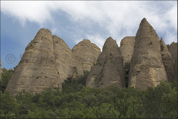 Dozens columns formed by a rocky agglomerate characterize Les Mees located not far from the town of Forcalquier Dozens columns formed by a rocky agglomerate characterize Les Mees located not far from the town of Forcalquier