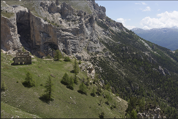 The ancient barracks of the Pramand fort and behind the military road of the Saracen tunnel