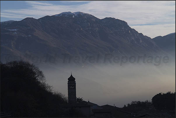 The evening mists on the lake seen from the village of Tenno above Riva del Garda
