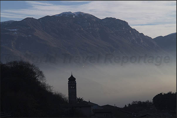 The evening mists on the lake seen from the village of Tenno above Riva del Garda The evening mists on the lake seen from the village of Tenno above Riva del Garda