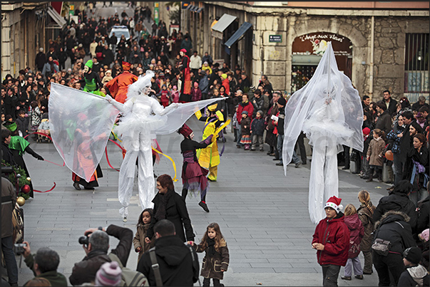 Christmas opening parade through the streets of the old town where there are squares and streets with Christmas markets Christmas opening parade through the streets of the old town where there are squares and streets with Christmas markets