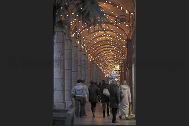 The arcades of the historic center that lead to the Christmas market under the castle The arcades of the historic center that lead to the Christmas market under the castle
