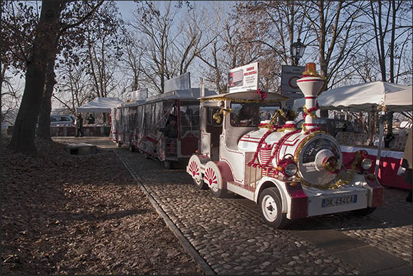 The train that crosses the Christmas markets outside the walls of the castle of Govone The train that crosses the Christmas markets outside the walls of the castle of Govone
