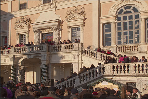 Children, parents and tourists are waiting to be welcomed by Santa Claus